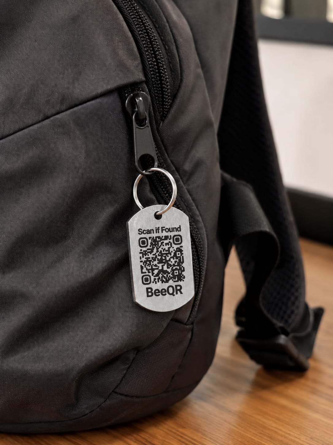 BeeQR mini dog tag on a backpack